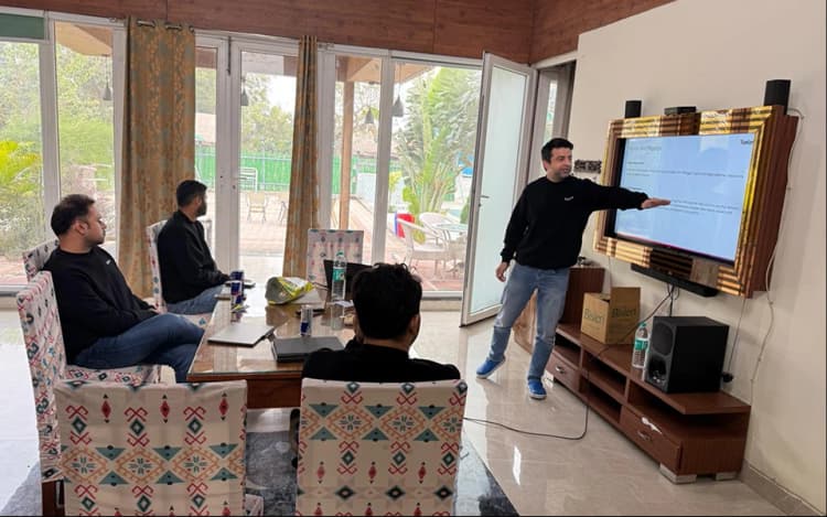 Team reviewing a project on a screen