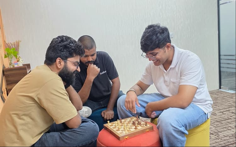 Colleagues playing chess together