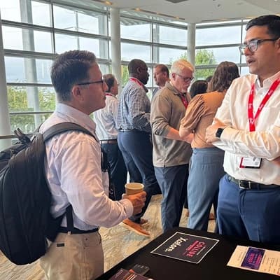 Team discussing at a conference